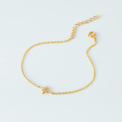 Gold bracelet with a star charm, minimal design